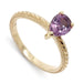 14kt yellow gold engagement ring with pear cut pink sapphire and hand engraving
