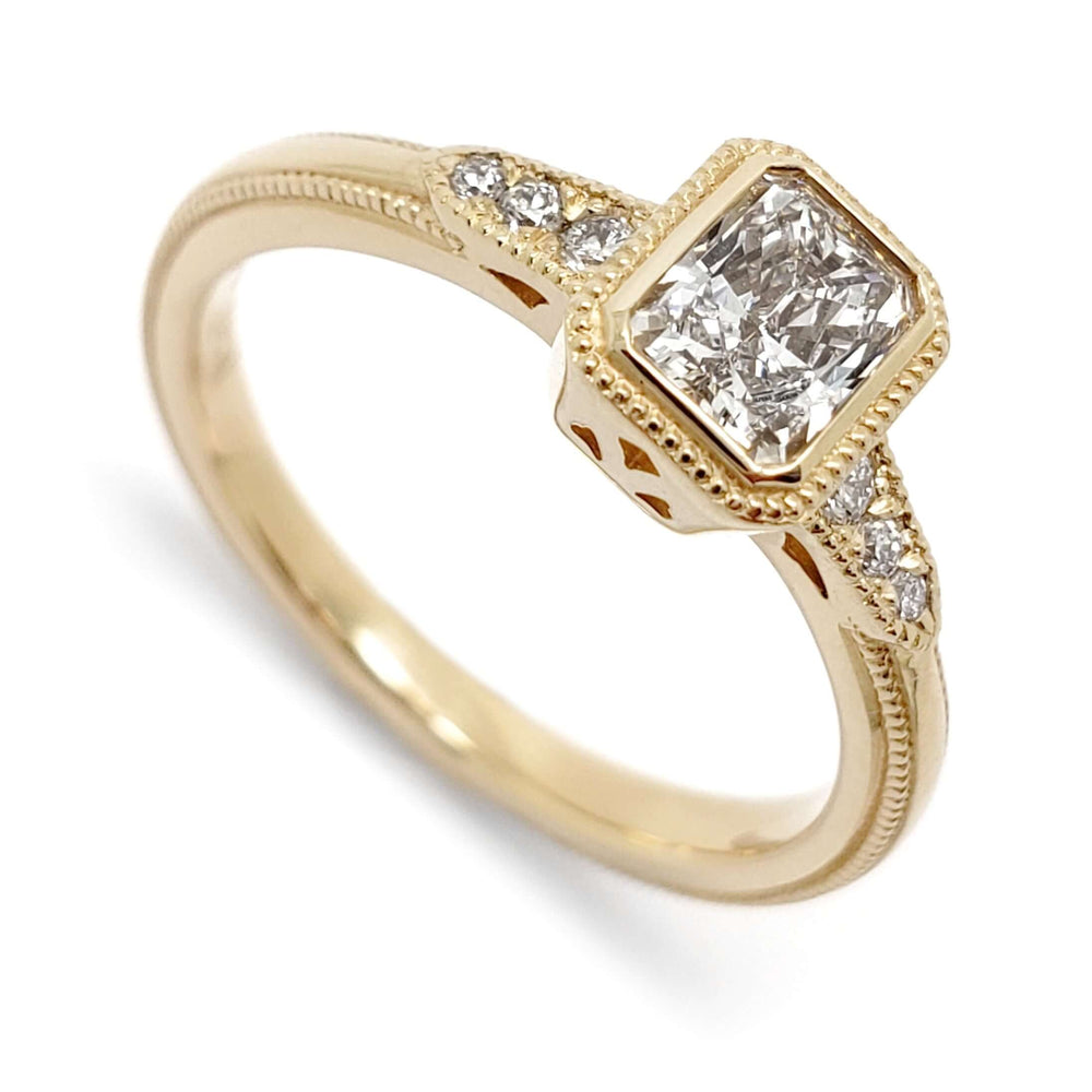 14kt yellow gold engagement ring with radiant cut lab diamond and round accent diamonds