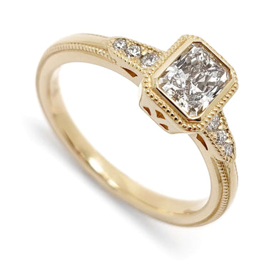 14kt yellow gold engagement ring with radiant cut lab diamond and round accent diamonds