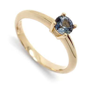 14kt yellow gold engagement ring with round blue Montana sapphire in solitaire setting