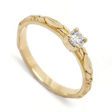 14kt yellow gold engagement ring with a round brilliant diamond and raised leaf details