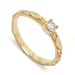 14kt yellow gold engagement ring with a round brilliant diamond and raised leaf details