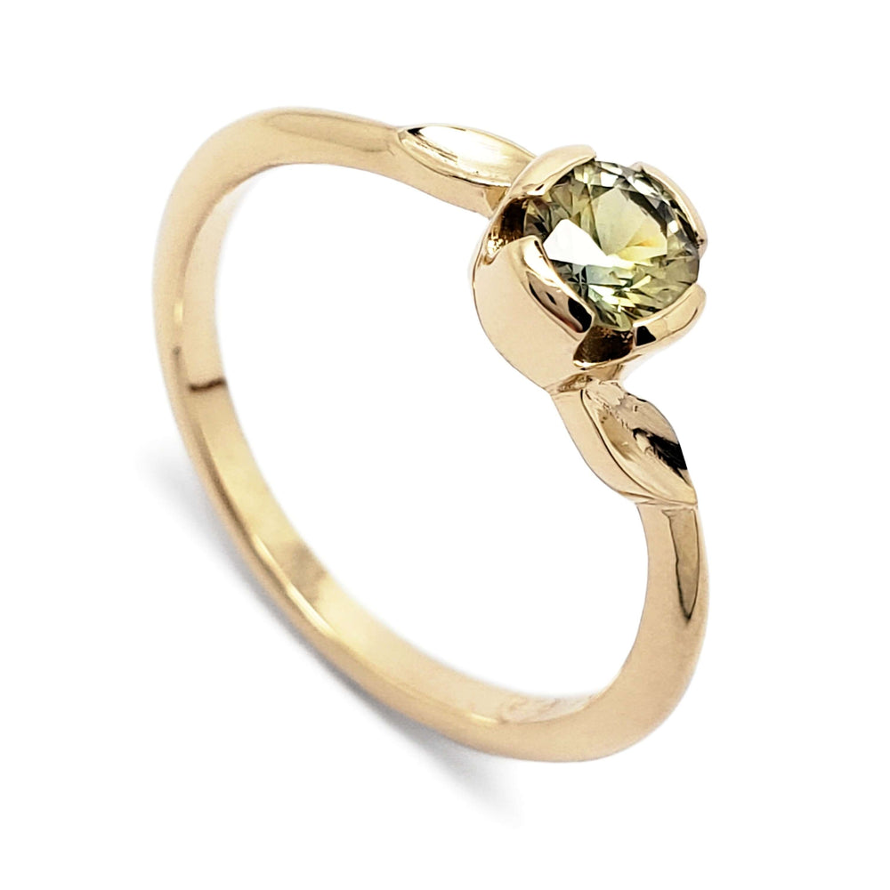 14kt yellow gold engagement ring with round green Montana sapphire and leaf details