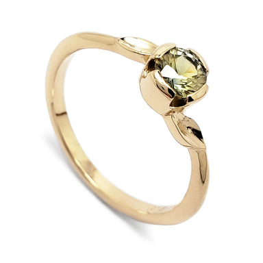 14kt yellow gold engagement ring with round green Montana sapphire and leaf details