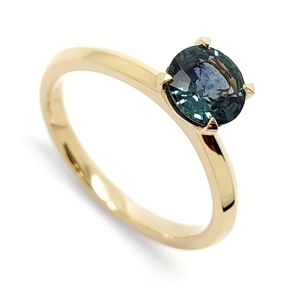 14kt yellow gold engagement ring with round teal Montana sapphire solitaire