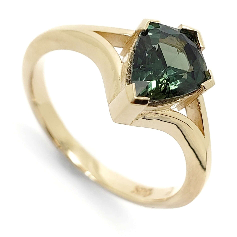 14kt yellow gold engagement ring with shield cut teal sapphire, split-shank setting