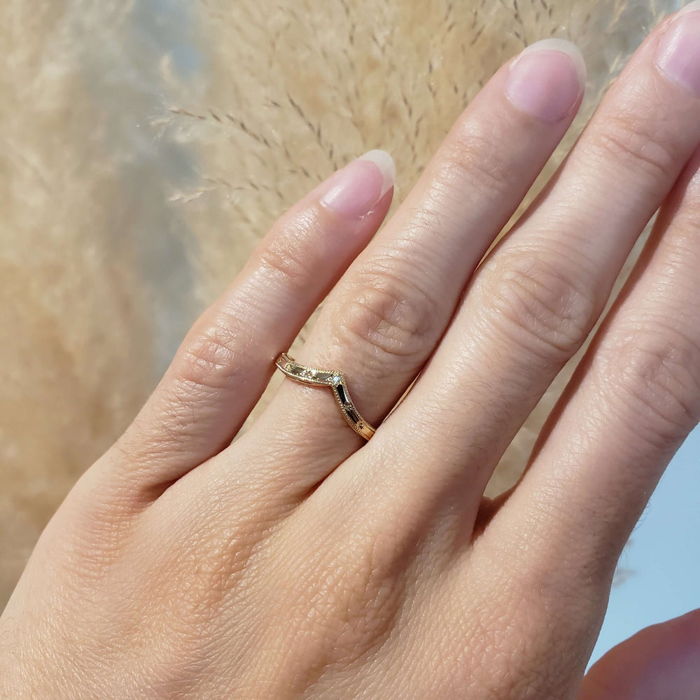 14kt yellow gold engraved chevron diamond ring worn on a hand