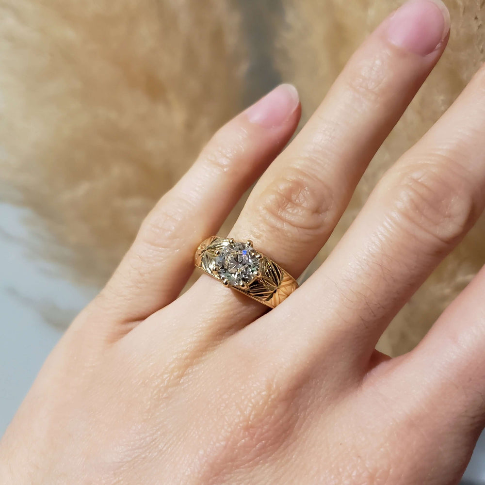 14kt yellow gold engraved engagement ring with lab diamond shown on hand