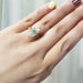 Engraved 14kt yellow gold wedding ring stacked with a marquise diamond engagement ring