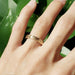14kt yellow gold engraved wedding ring worn on hand