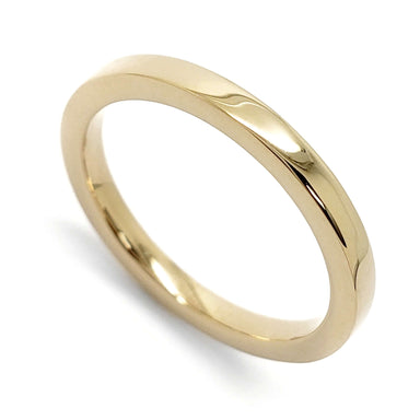 14kt yellow gold flat polished wedding ring on white background