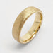 14kt yellow gold flat wedding band with rolled edge and saw blade finish
