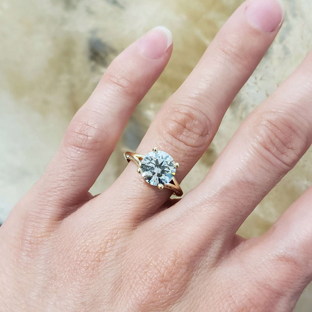14kt yellow gold lab diamond engagement ring shown on a hand