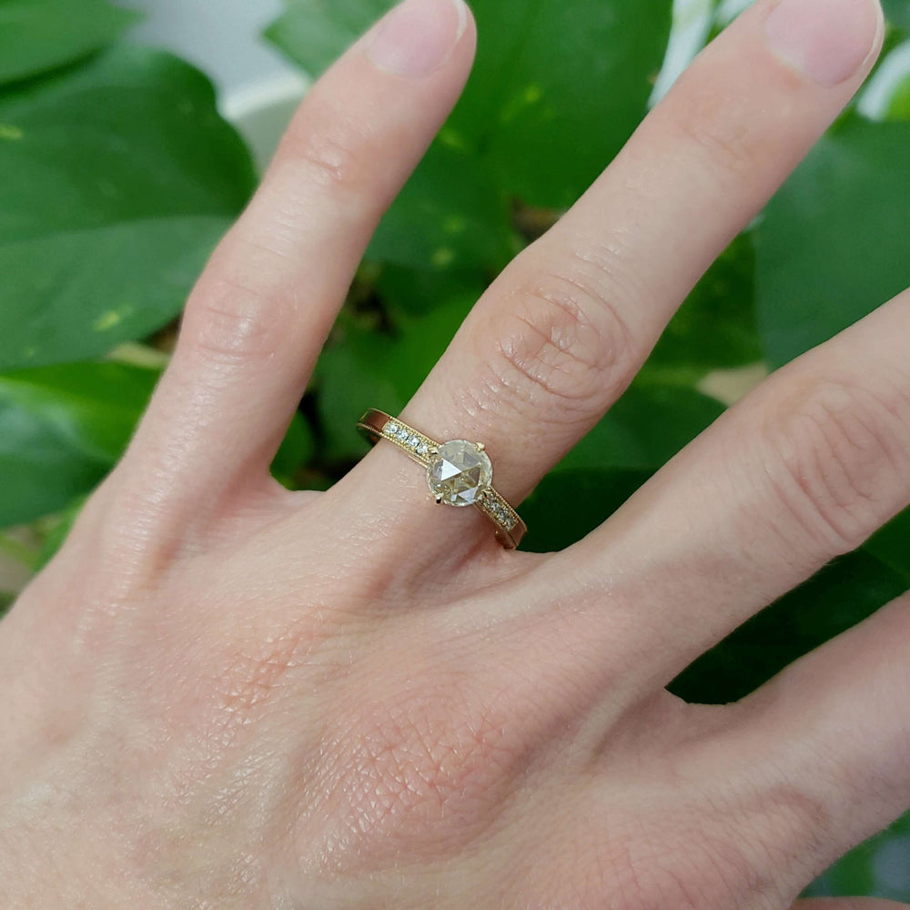 14kt yellow gold lab diamond engagement ring shown on hand