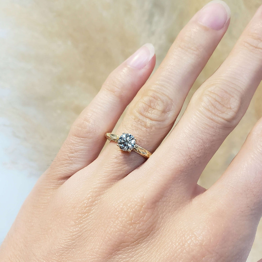 14kt yellow gold lab diamond engagement ring shown on hand