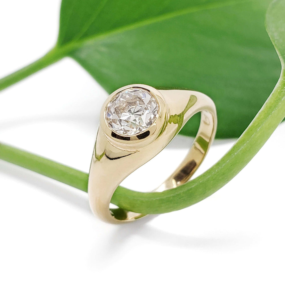 14kt yellow gold lab diamond engagement ring styled with green leaf
