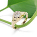 14kt yellow gold lab diamond engagement ring styled with green leaf