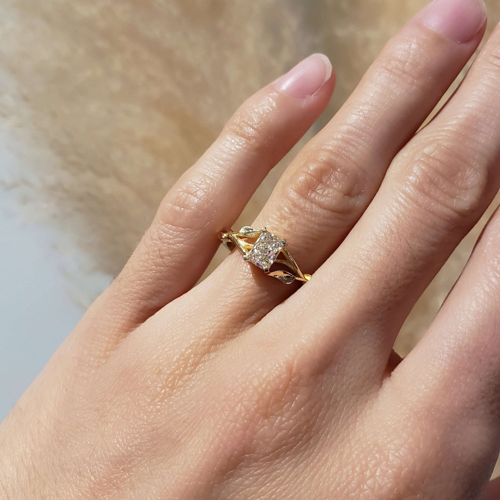 14kt yellow gold lab diamond engagement ring with leaf detail shown on hand