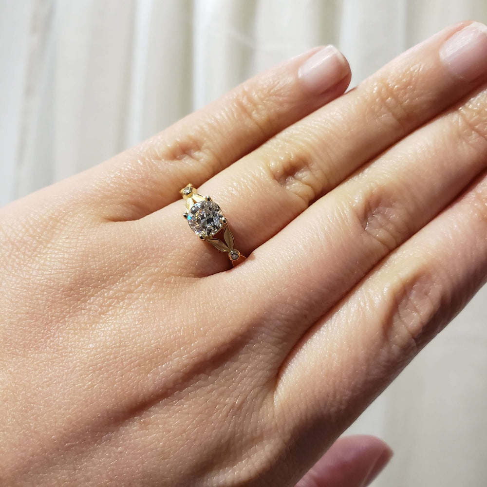 14kt yellow gold lab diamond engagement ring worn on a hand