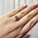 14kt yellow gold lab diamond engagement ring worn on a hand