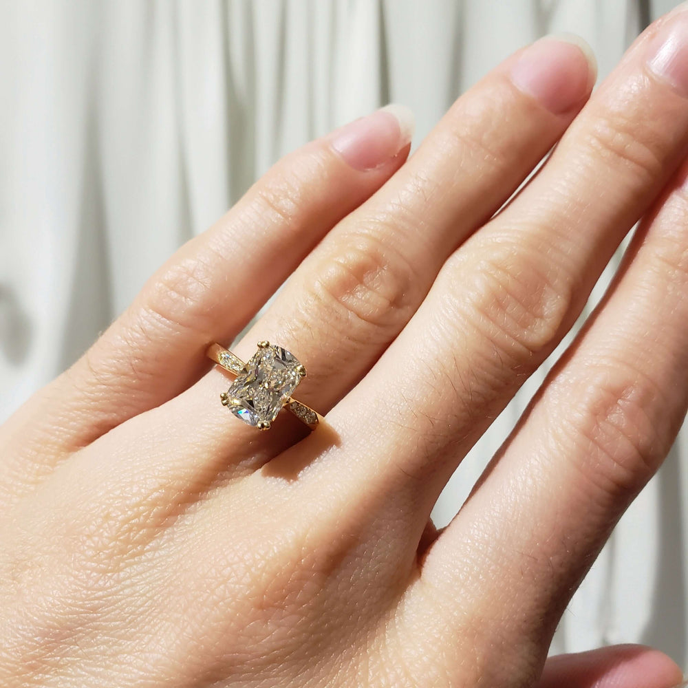 14kt yellow gold lab diamond engagement ring worn on hand
