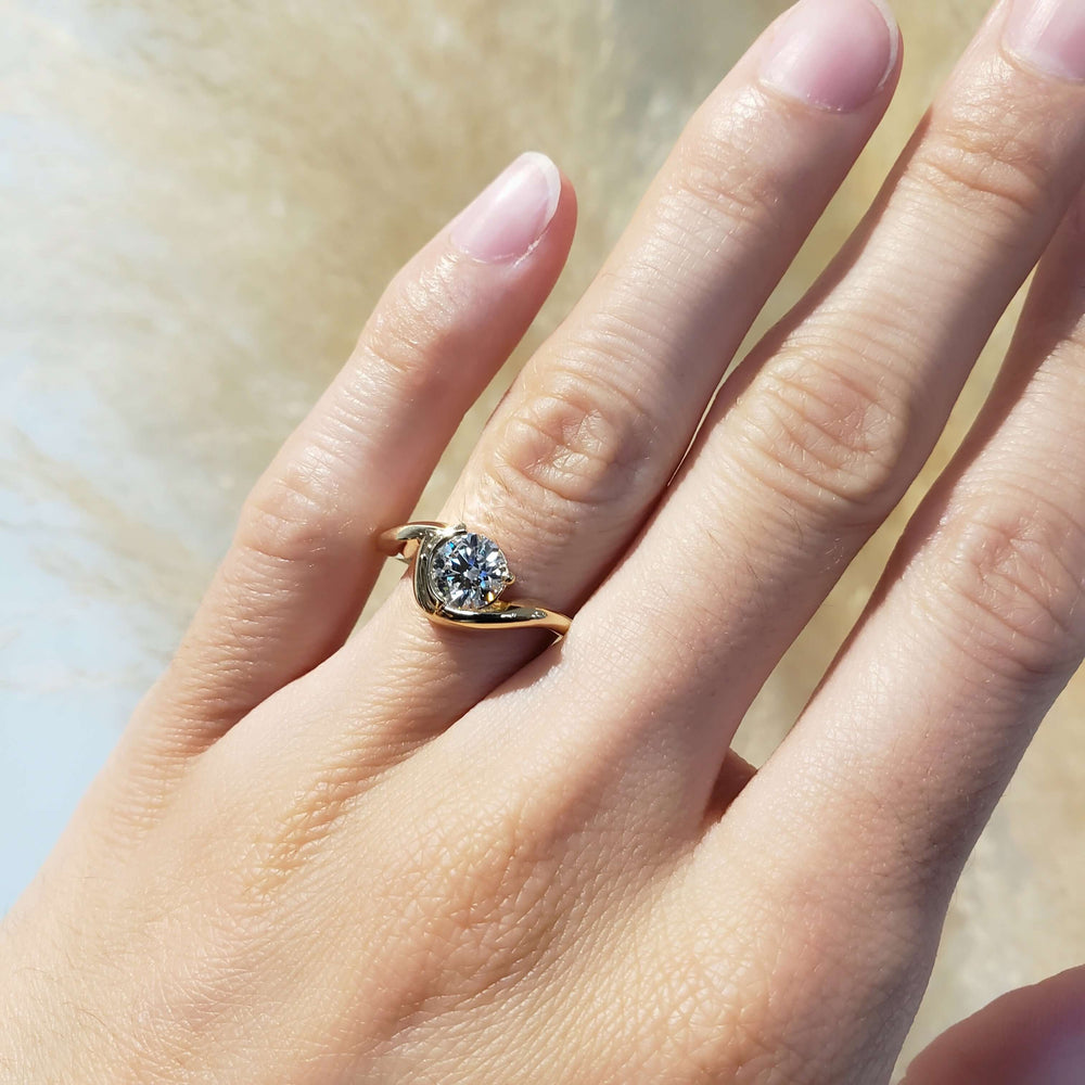 14kt yellow gold lab diamond engagement ring worn on hand in natural light
