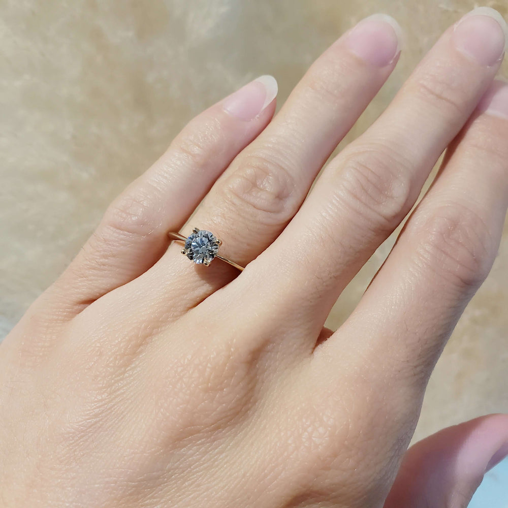 14kt yellow gold lab diamond solitaire ring shown on hand