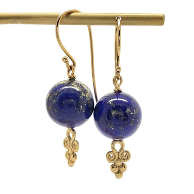Pair of handcrafted 14kt yellow gold drop earrings with round blue lapis lazuli beads and gold scroll accents