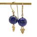 Pair of handcrafted 14kt yellow gold drop earrings with round blue lapis lazuli beads and gold scroll accents