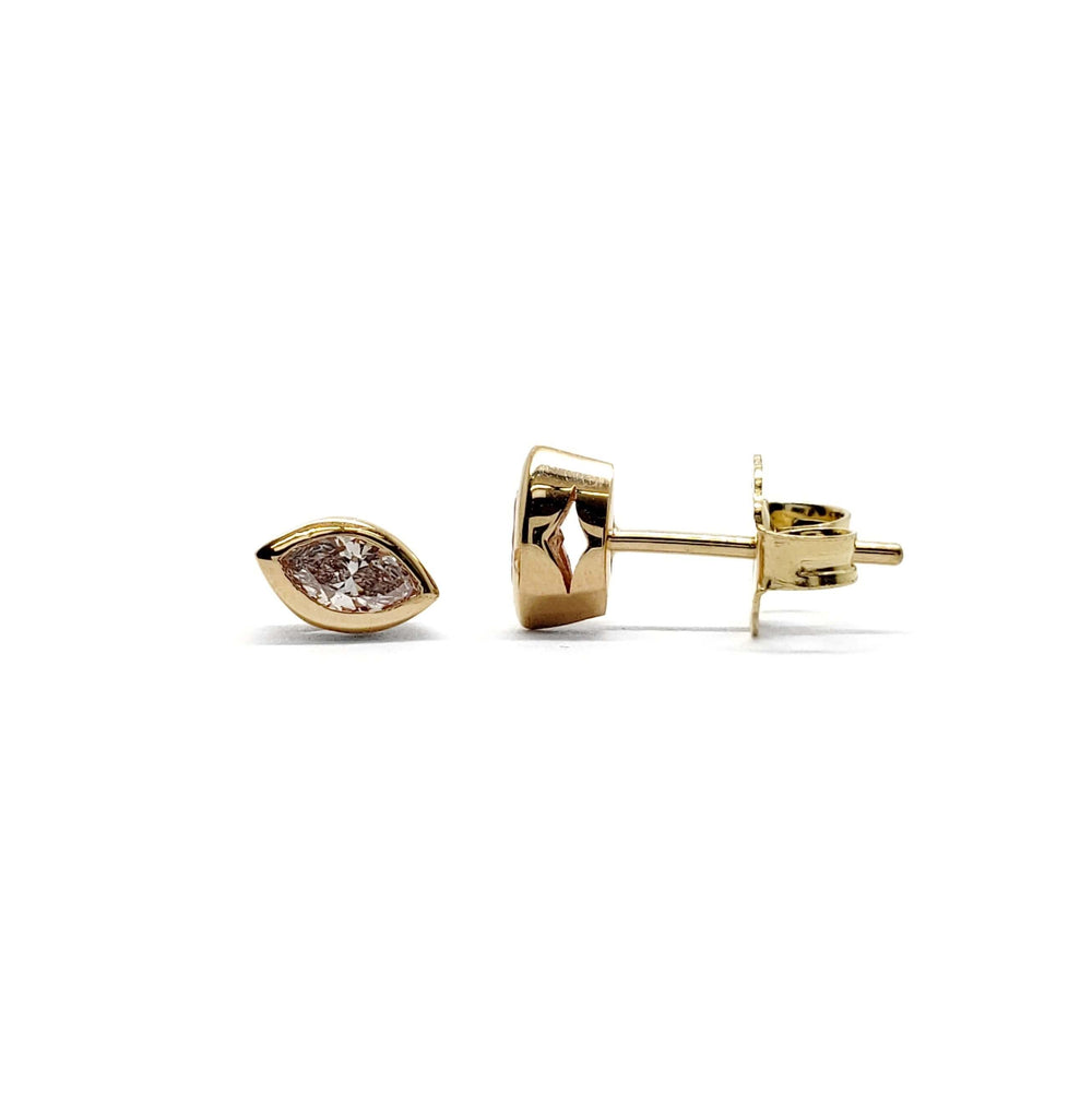 Pair of 14kt yellow gold stud earrings with marquise cut diamonds in bezel settings
