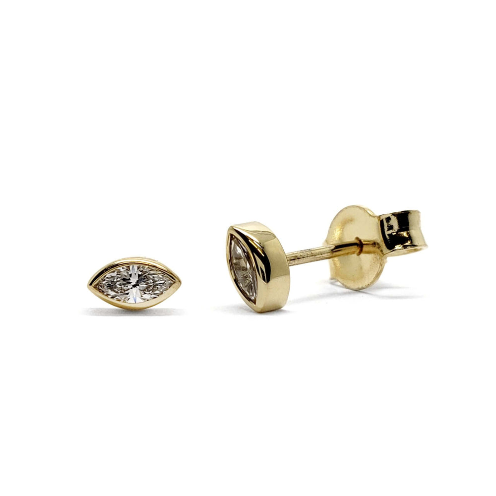 Pair of marquise cut lab diamond stud earrings in 14kt yellow gold with butterfly backings
