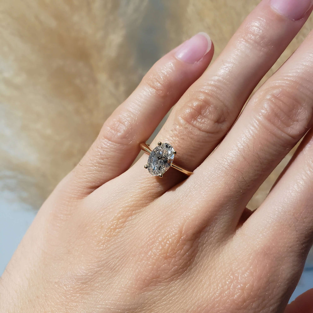 14kt yellow gold oval lab diamond ring shown on hand
