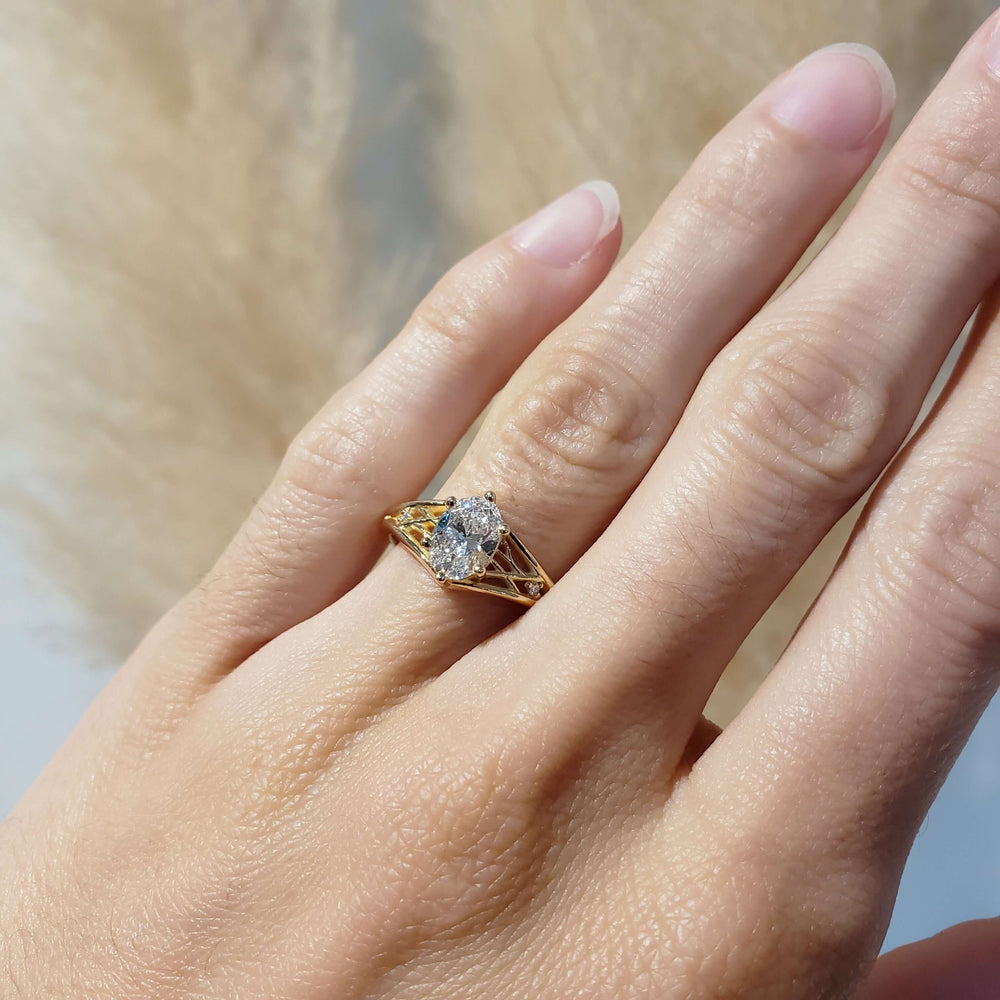14kt yellow gold oval lab diamond ring shown on hand