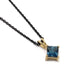 14kt yellow gold pendant with princess cut London topaz on a black chain
