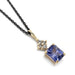 14kt yellow gold pendant with radiant blue sapphire and cluster of lab diamonds on black chain