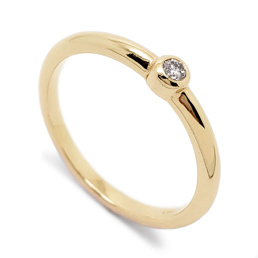 14kt yellow gold polished ring with bezel set Canadian diamond
