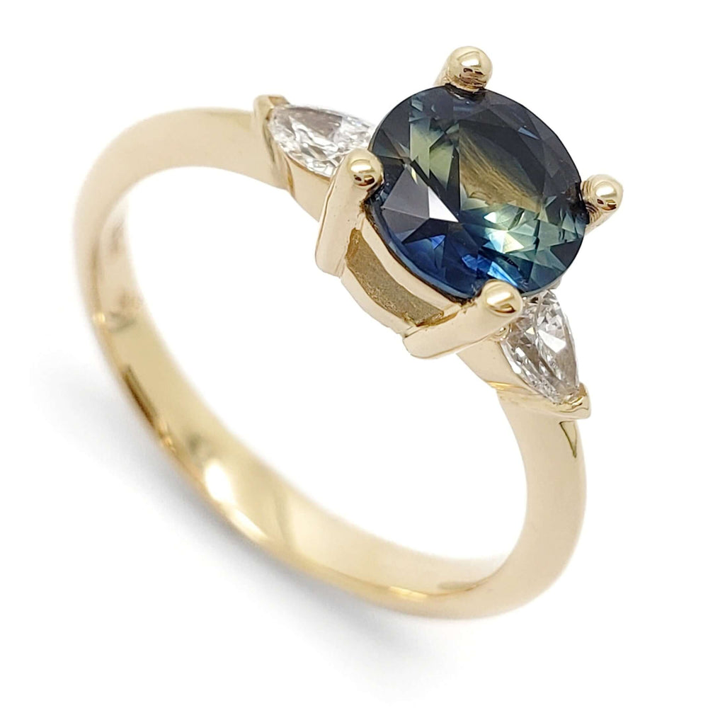 14kt yellow gold ring with round blue-green Australian sapphire and pear lab diamonds