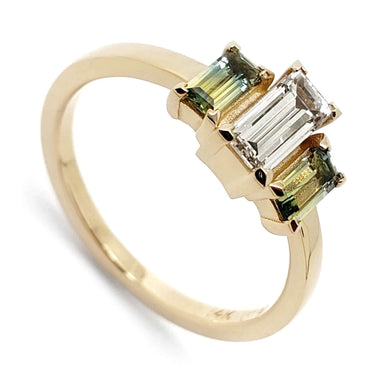 14kt yellow gold ring with a baguette Canadian diamond and two bi-colour Australian sapphires