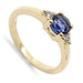 14kt yellow gold ring with round rose cut blue sapphire and two side diamonds