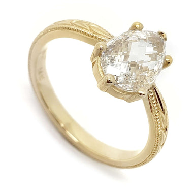 14kt yellow gold ring with checkerboard pear-cut lab diamond and hand engraving