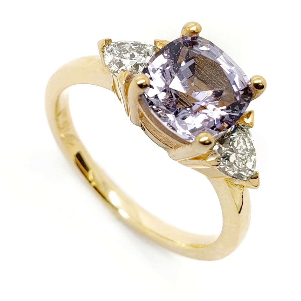 14kt yellow gold ring with cushion cut lavender sapphire and two trillion lab diamonds