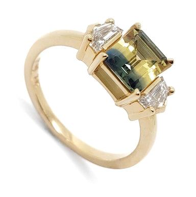 14kt yellow gold ring with emerald cut bi-colour Australian sapphire and two cadillac cut lab diamonds