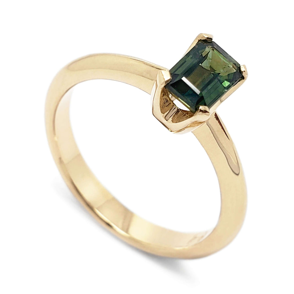 14kt yellow gold ring with emerald cut green Tanzanian sapphire, angled view