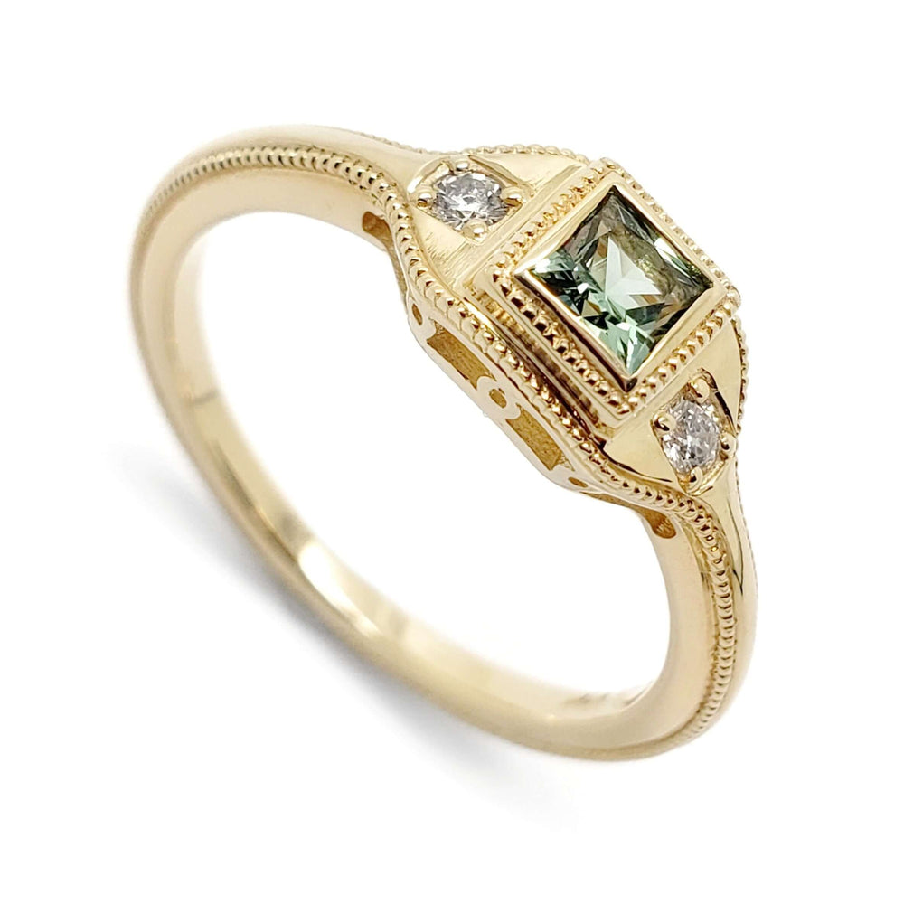 14kt yellow gold ring with princess cut green lab sapphire and two diamonds, millgrain detail
