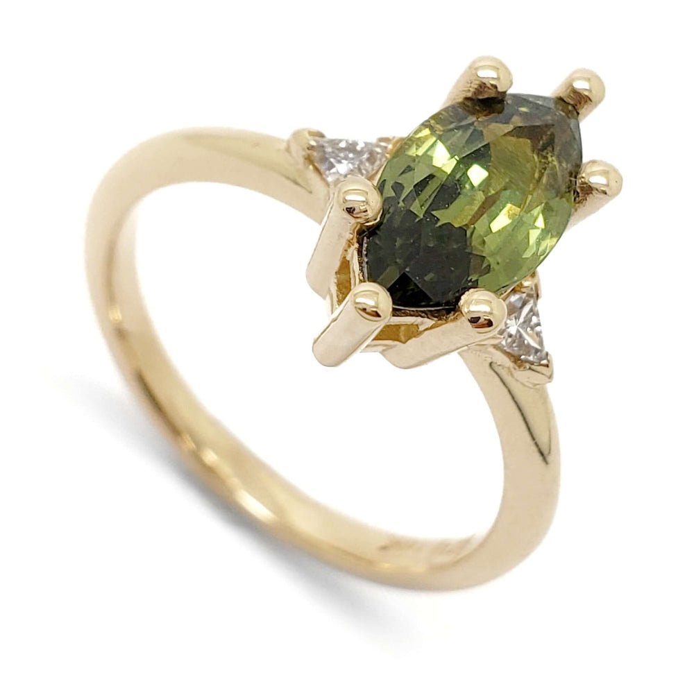 14kt yellow gold ring with marquise green sapphire and triangle lab diamonds, angled view