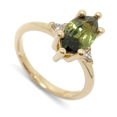 14kt yellow gold ring with marquise green sapphire and triangle lab diamonds, angled view