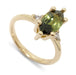 14kt yellow gold ring with marquise green sapphire and triangle lab diamonds, angled view