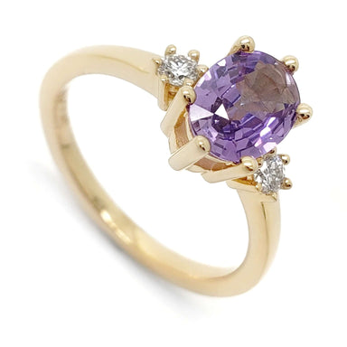 14kt yellow gold ring with oval lavender sapphire and two lab grown diamonds in claw setting
