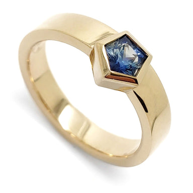14kt yellow gold ring with pentagon-cut blue Montana sapphire bezel set