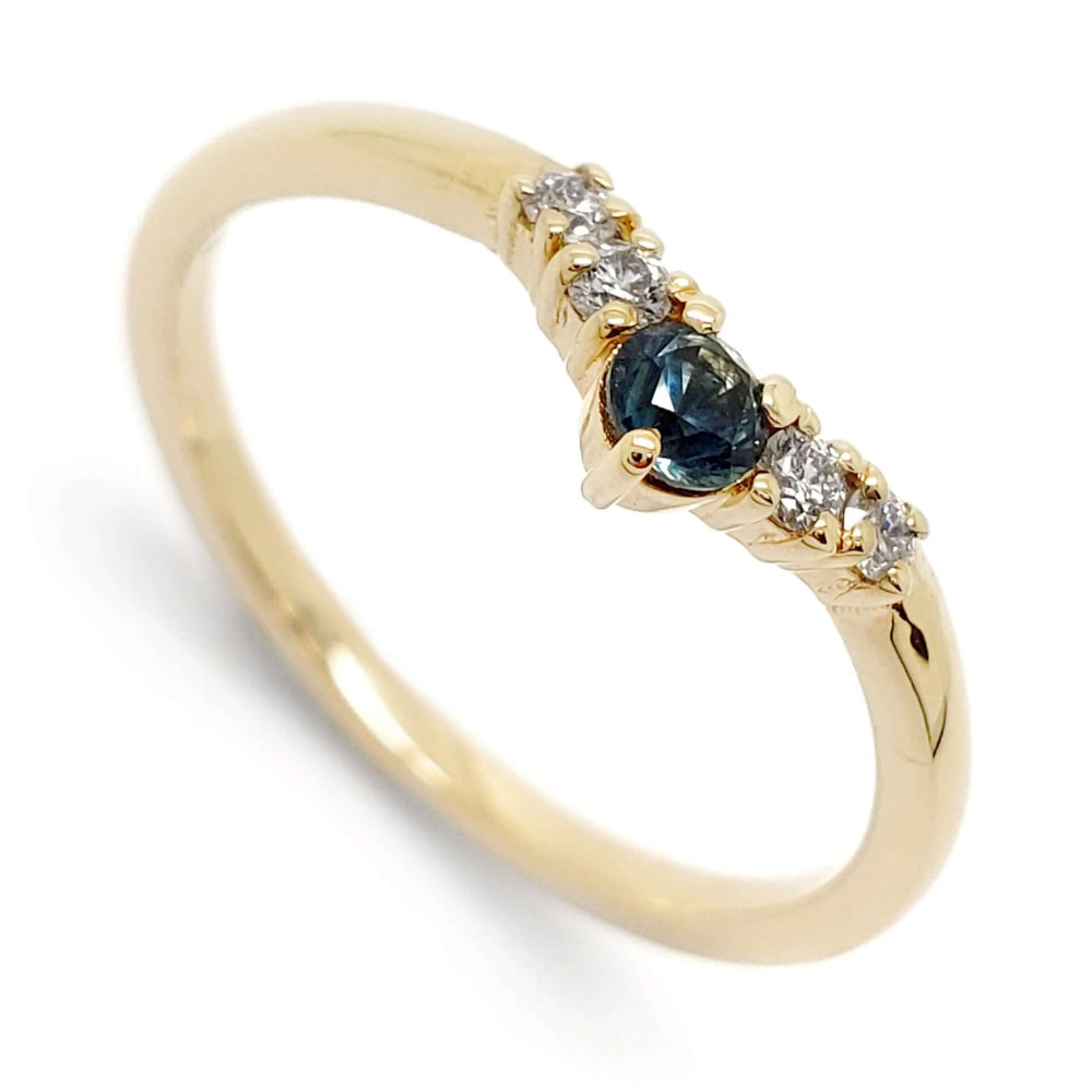 14kt yellow gold ring with round teal Montana sapphire and Canadian diamonds, close-up